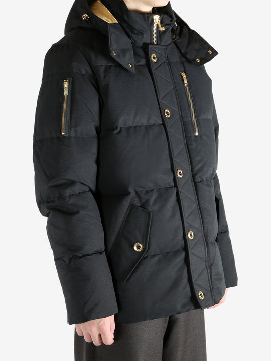Black jacket worn by a person, showing the jacket's fit