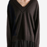 Brown sweater worn by a person, showing the sweater's fit