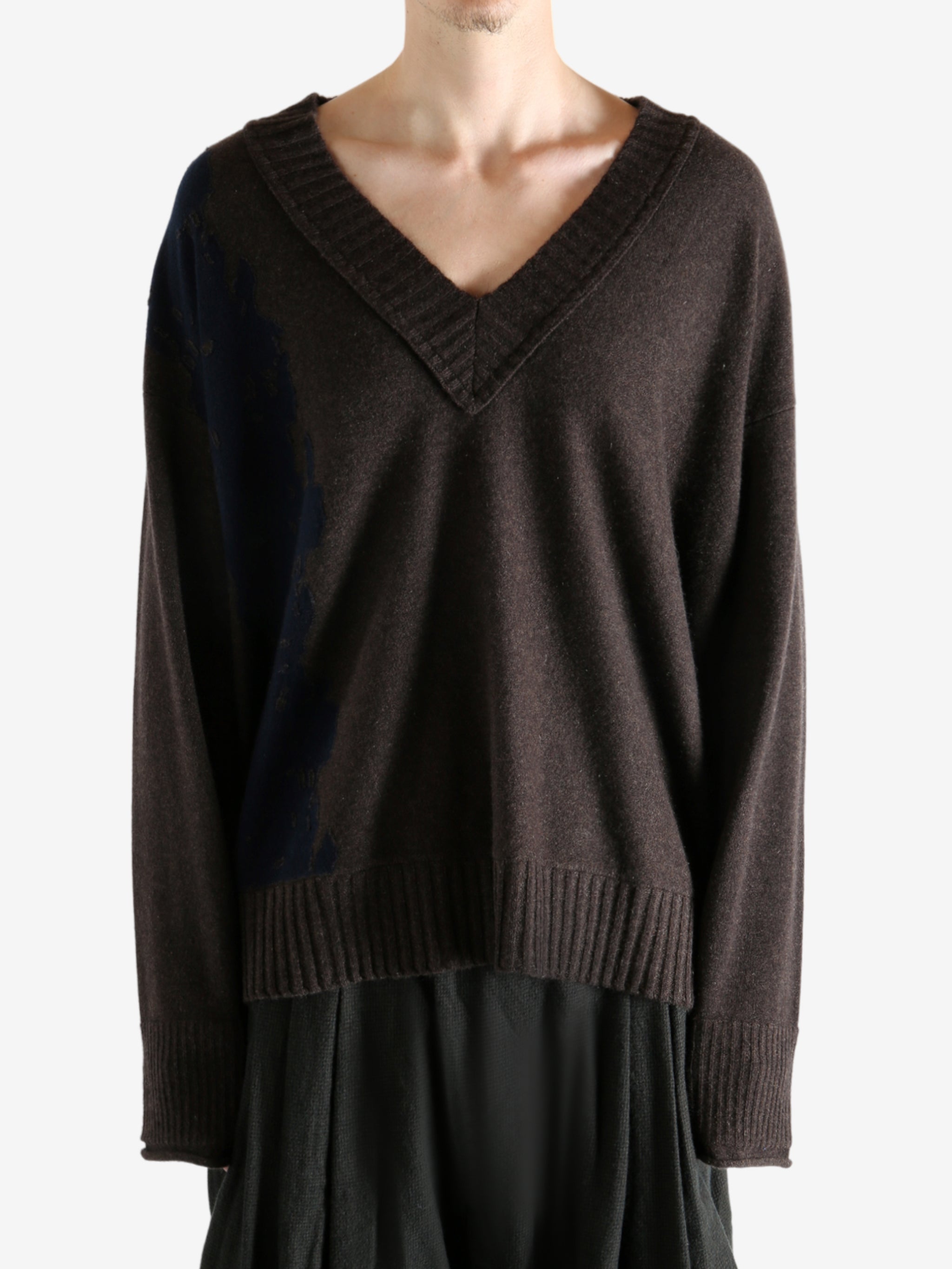 Brown sweater worn by a person, showing the sweater's fit