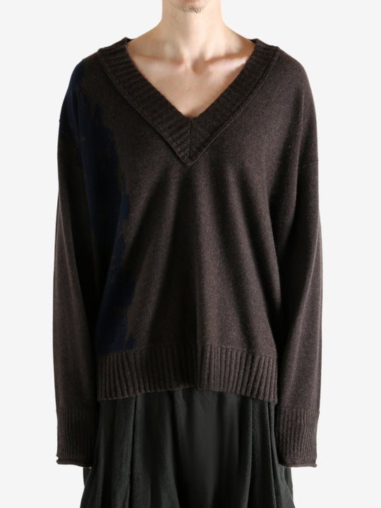 Brown sweater worn by a person, showing the sweater's fit