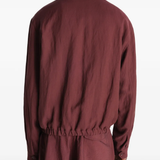 Red jacket worn by a person, showing the jacket's fit