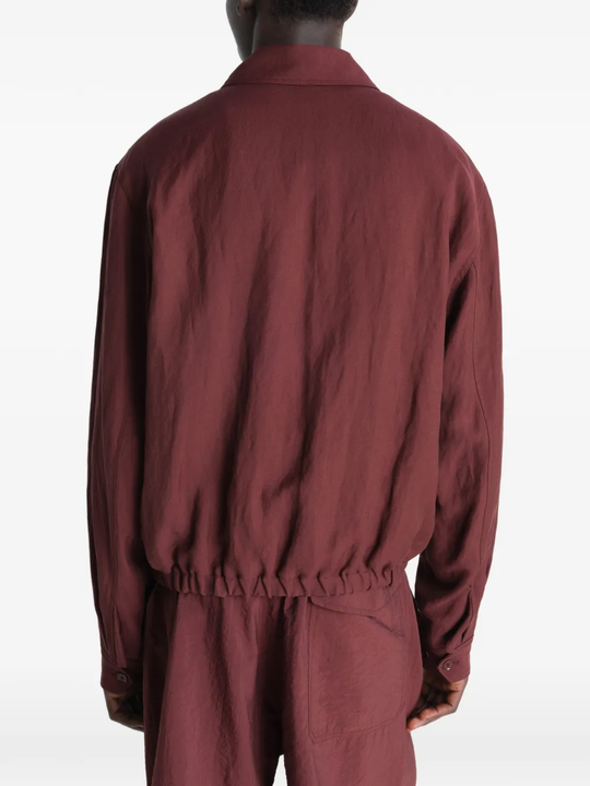 Red jacket worn by a person, showing the jacket's fit