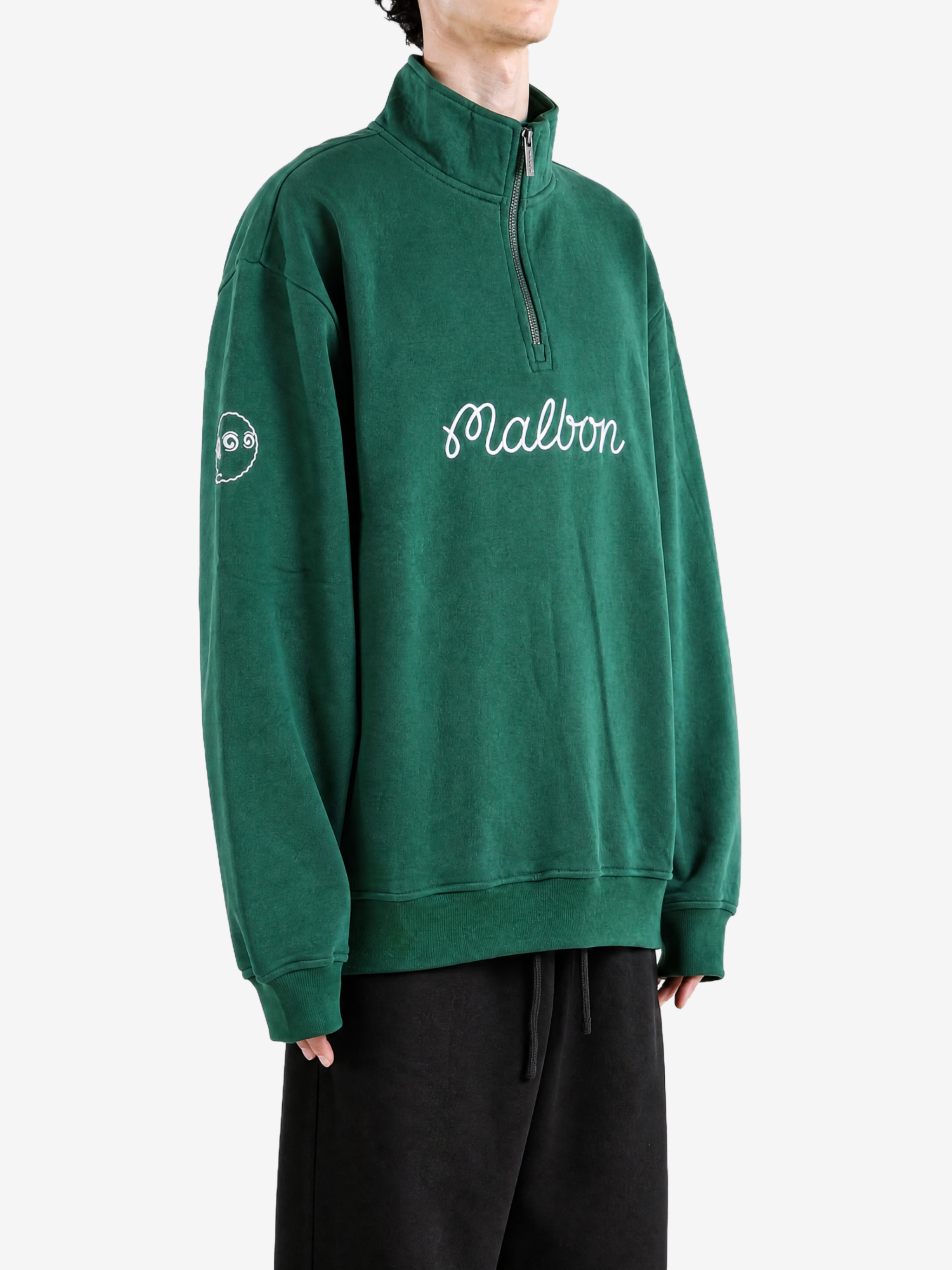 Green hoodie worn by a person, showing the hoodie fit