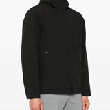 Black jackets worn by a person, showing the jackets fit