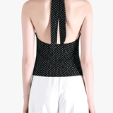 Black top worn by a person, showing the top fit