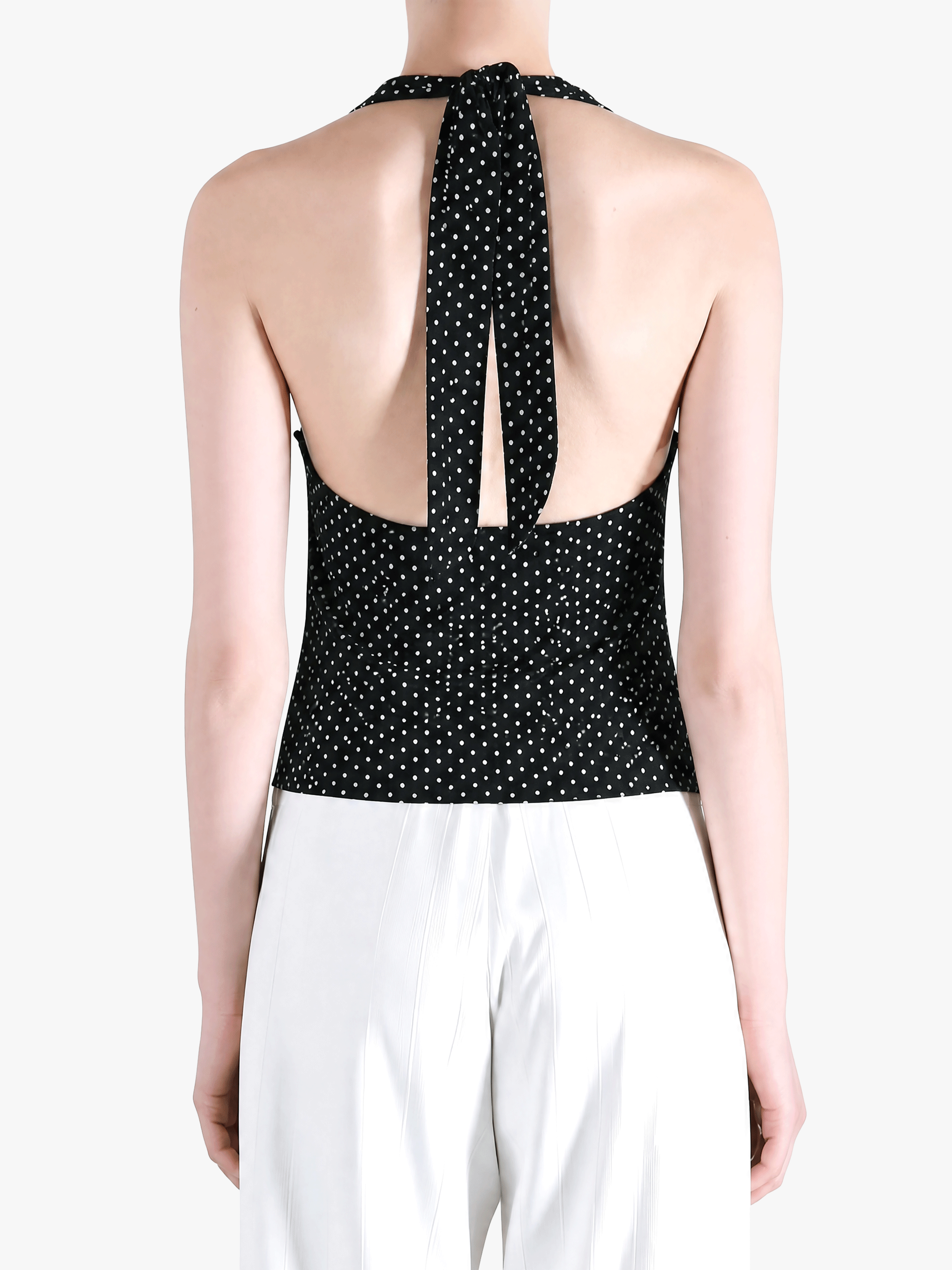 Black top worn by a person, showing the top fit