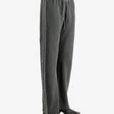 Grey pants worn by a person, showing the pants' fit