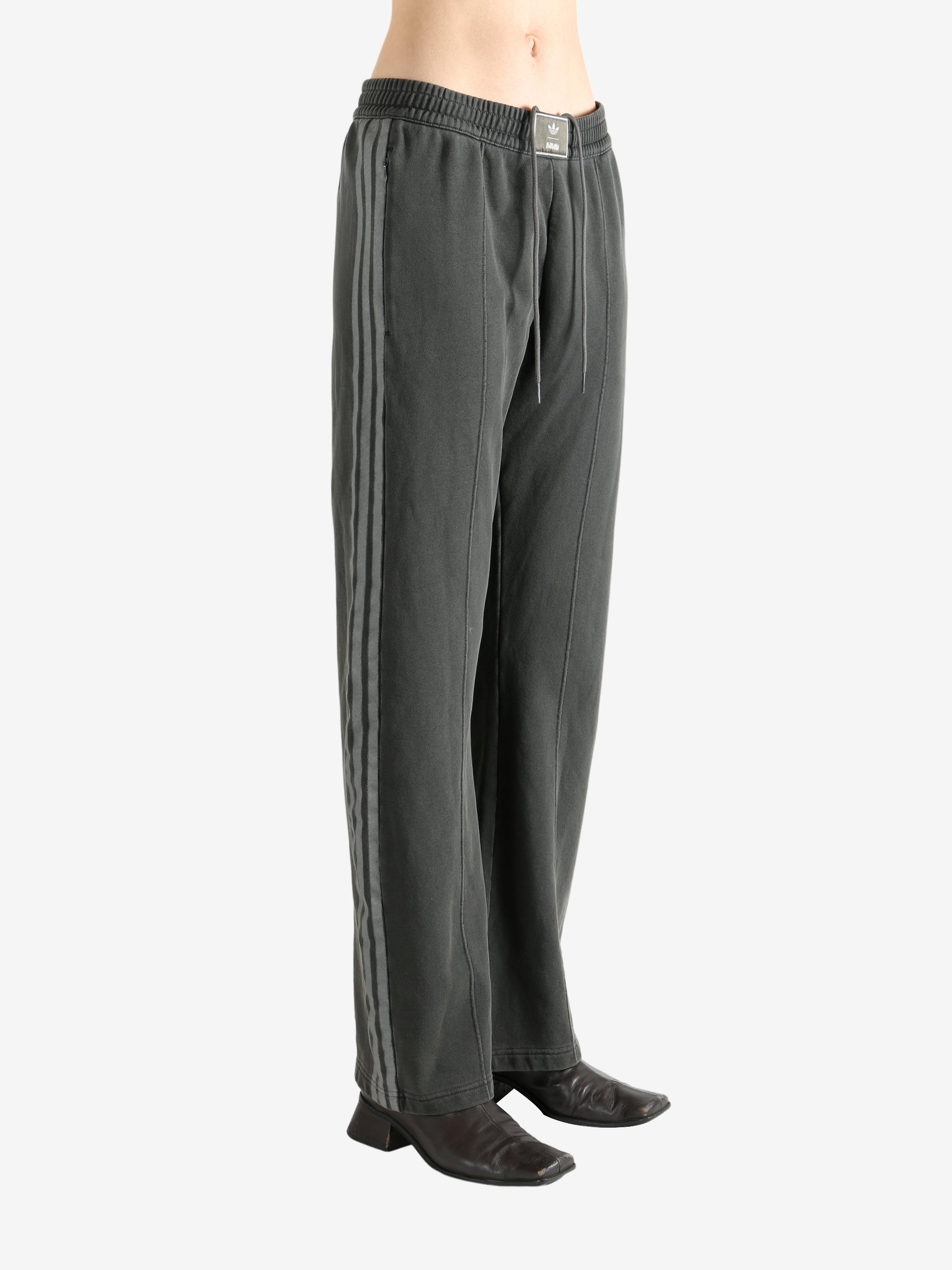 Grey pants worn by a person, showing the pants' fit