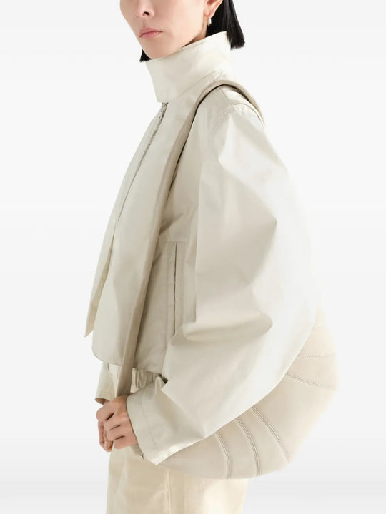 Tan bag worn by a person, showing the bag fit