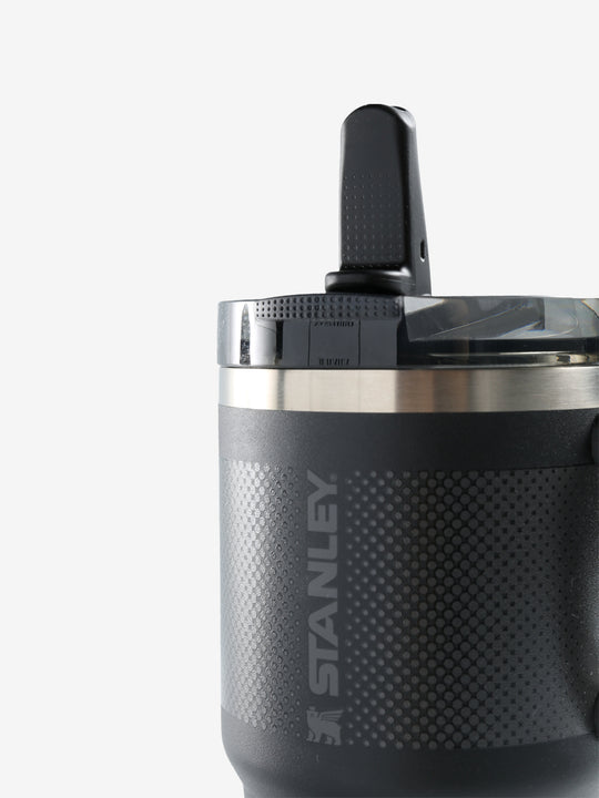Close up of black tumbler, showing texture of the stainless steel fabric