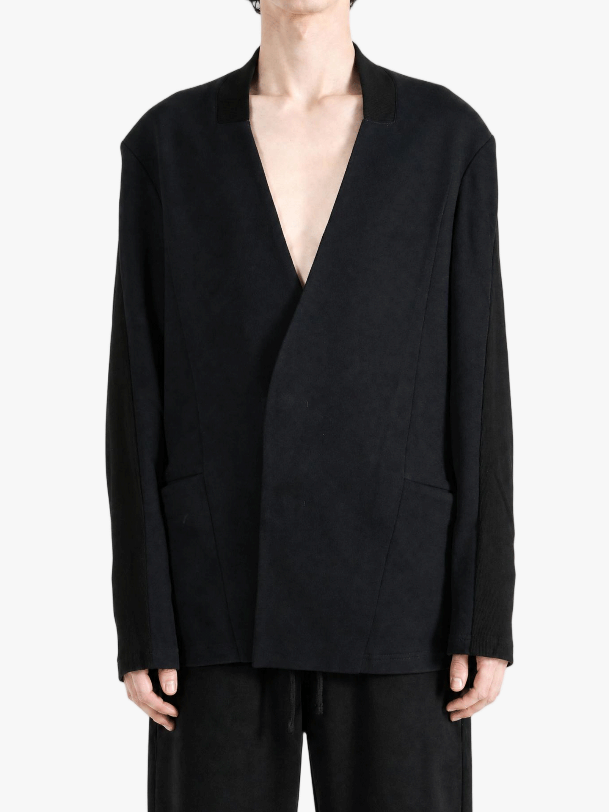 Black jacket worn by a person, showing the jacket fit