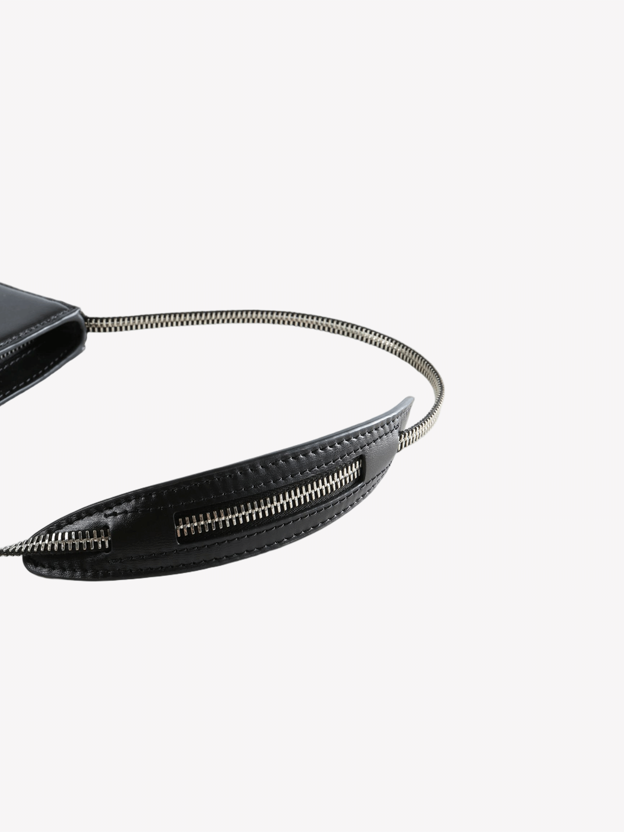 Close up of the black bag, showing texture of the leather fabric