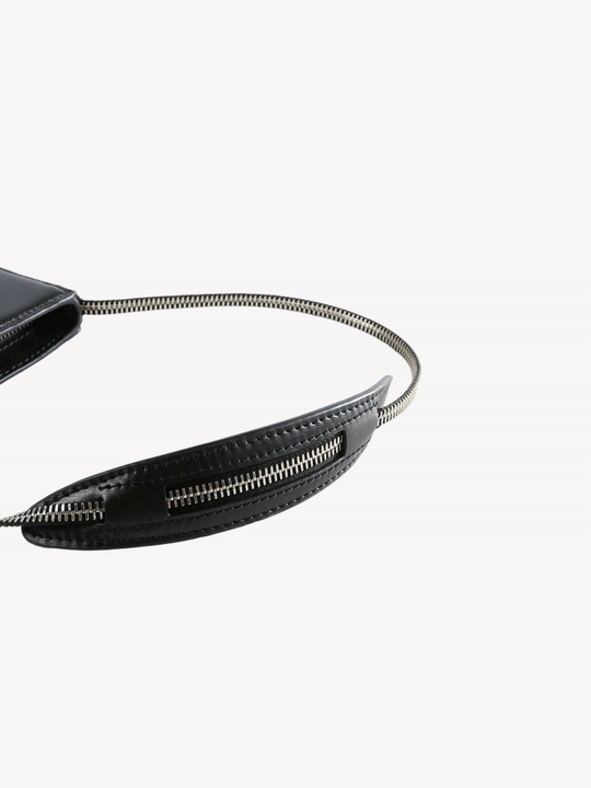 Close up of the black bag, showing texture of the leather fabric