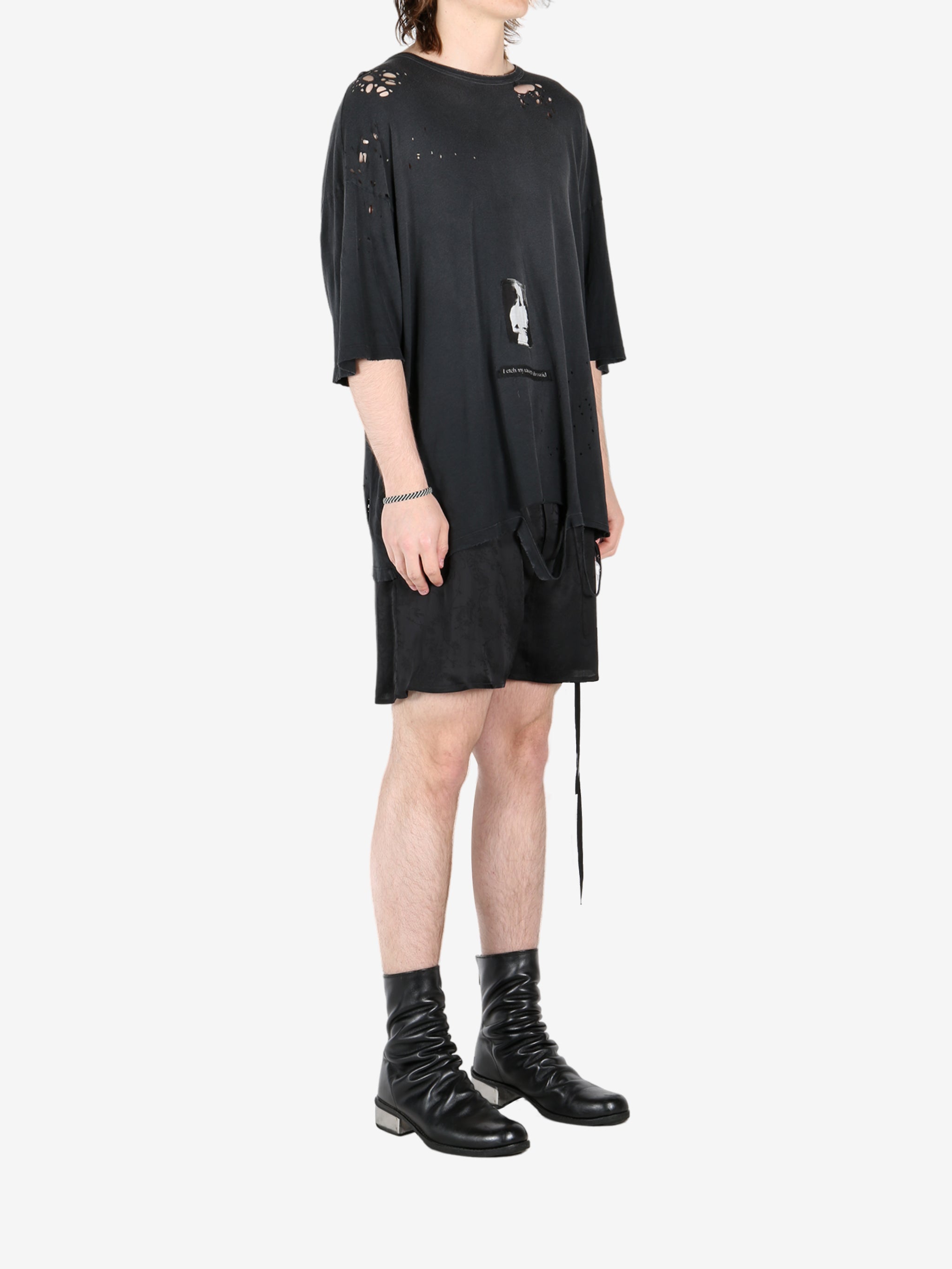 Black t-shirt, worn by a person, showing the t-shirt's fit