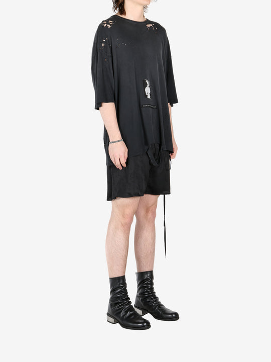 Black t-shirt, worn by a person, showing the t-shirt's fit