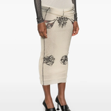 Tan skirt worn by a person, showing the skirt's fit