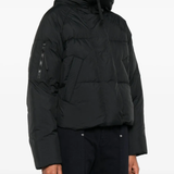 Black jacket worn by a person, showing the jacket fit