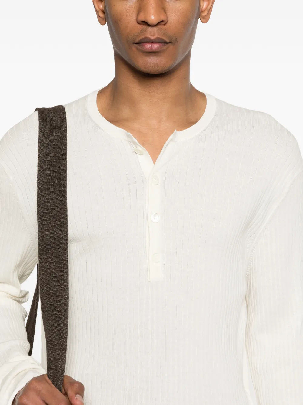 Close up of white knitwear, showing texture of the Cotton fabric