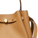 Close up of brown bag, showing texture of the leather fabric