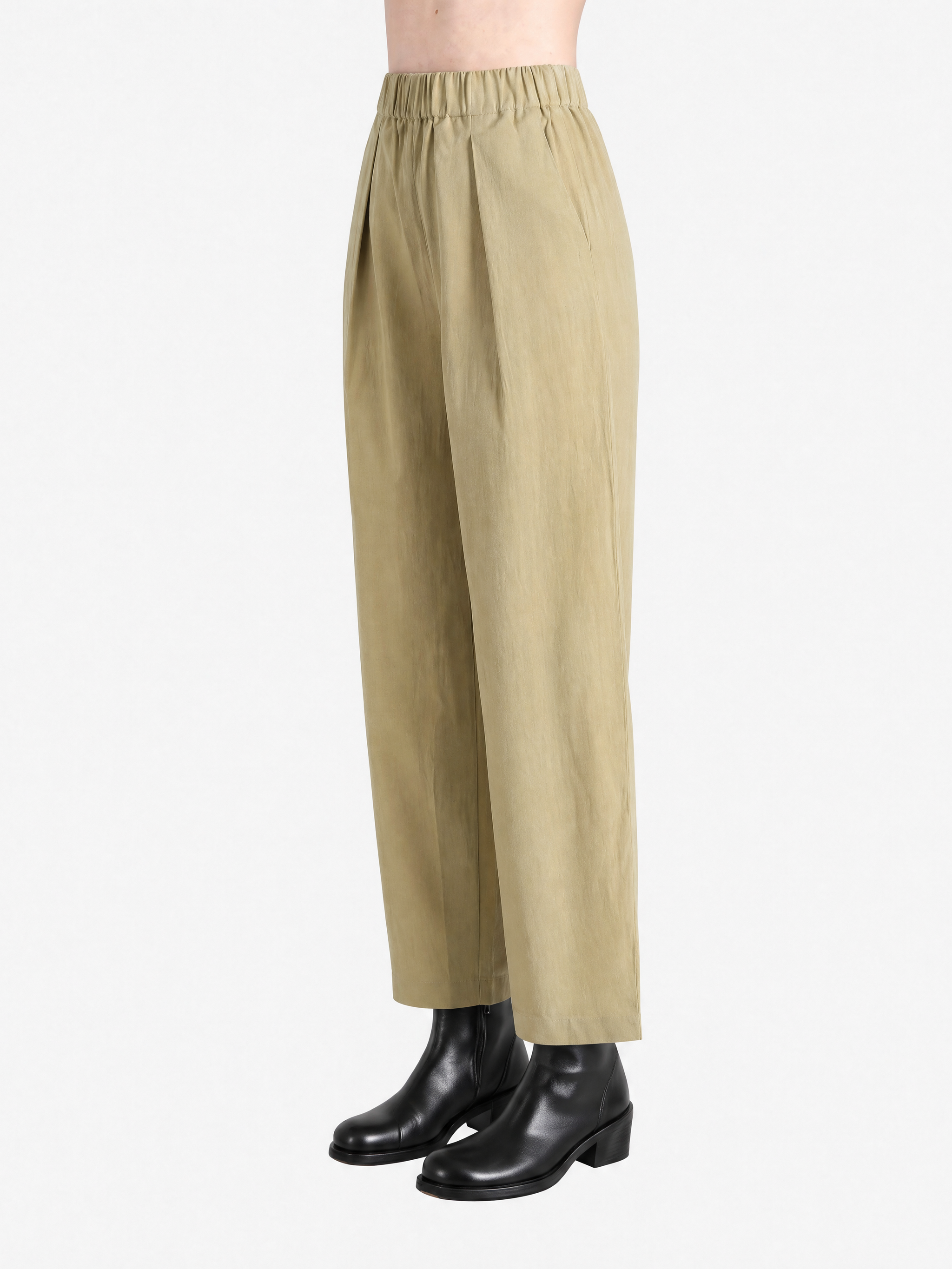 Brown pants worn by a person, showing the pants fit