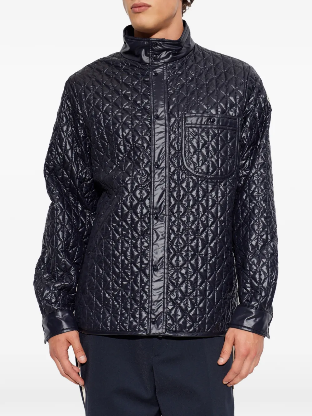 Blue jacket worn by a person, showing the jacket fit