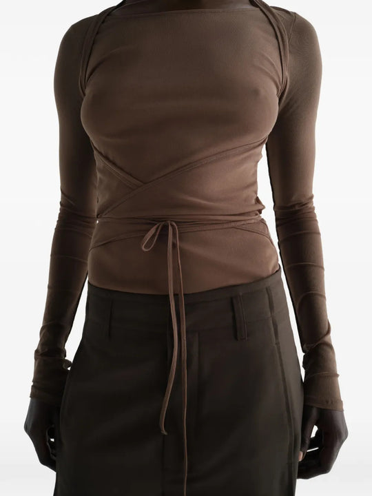 Brown top worn by a person, showing the top fit