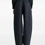 Navy pants worn by a person, showing the pants fit