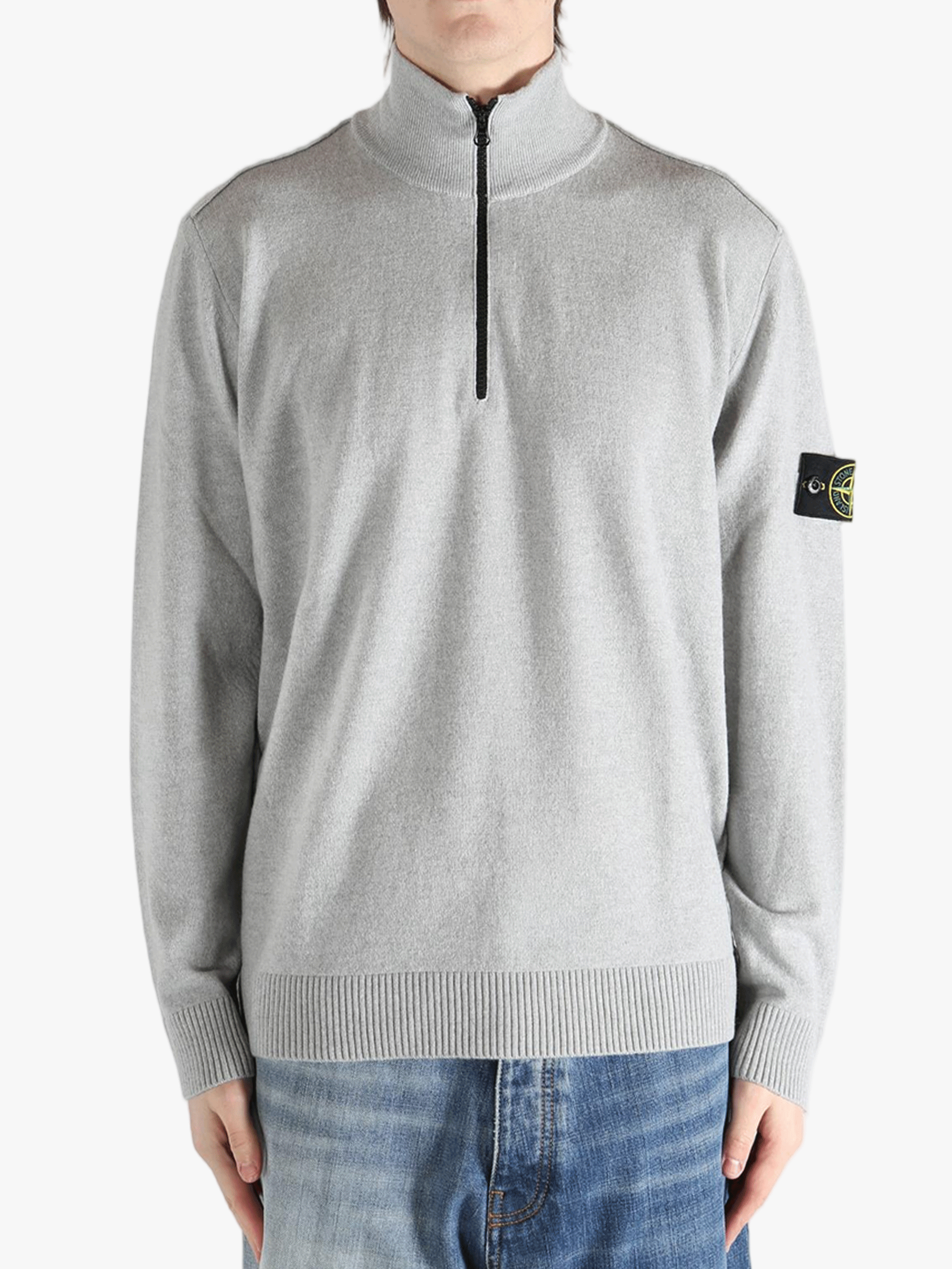 Gray sweater worn by a person, showing the sweater fit