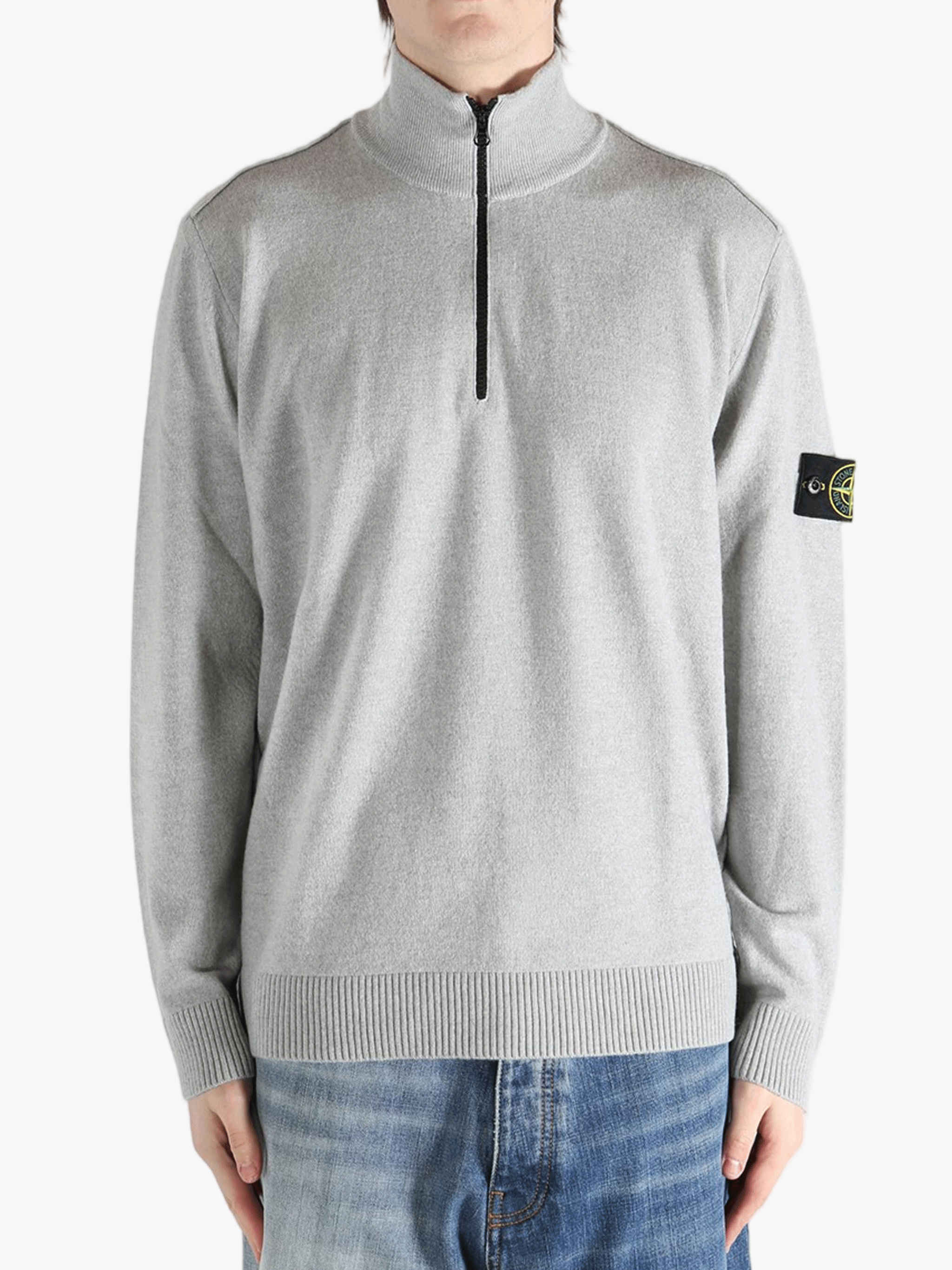 Gray sweater worn by a person, showing the sweater fit