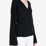Black jacket worn by a person, showing the jacket fit