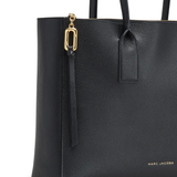 Close up of the black bags, showing texture of the leather