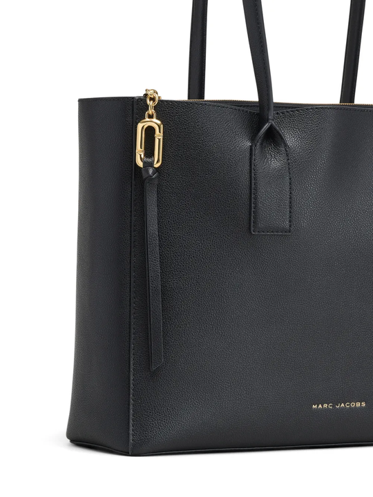 Close up of the black bags, showing texture of the leather