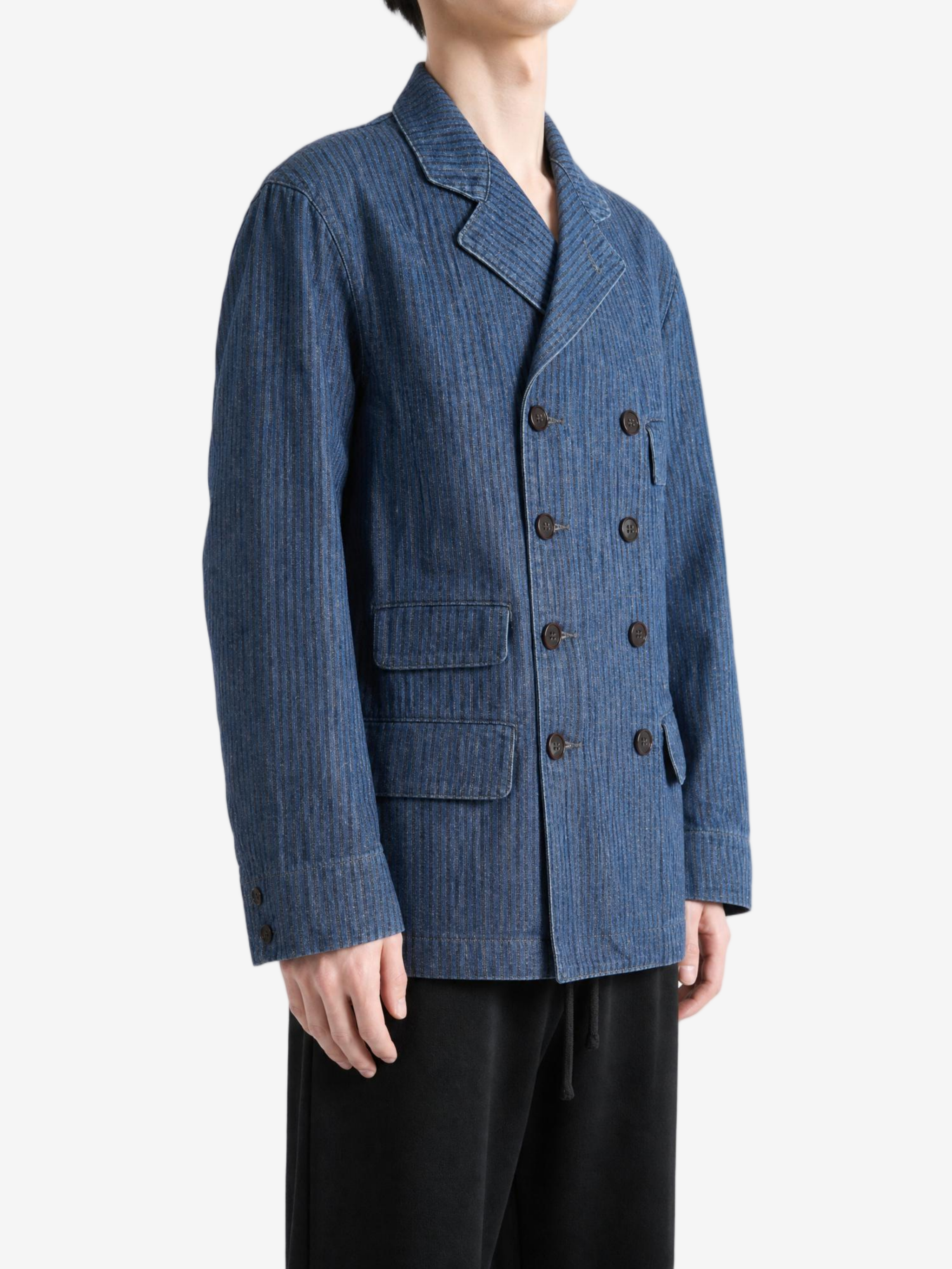 Blue jacket worn by a person, showing the jacket fit
