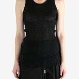 Black top worn by a person, showing the top's fit