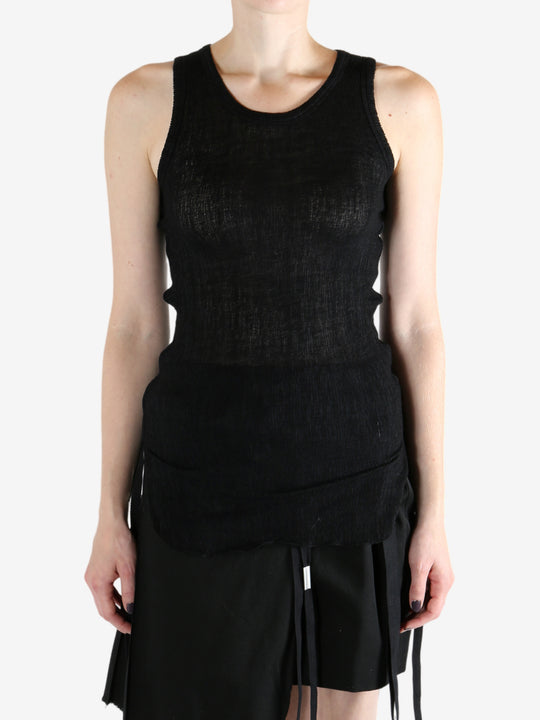 Black top worn by a person, showing the top's fit