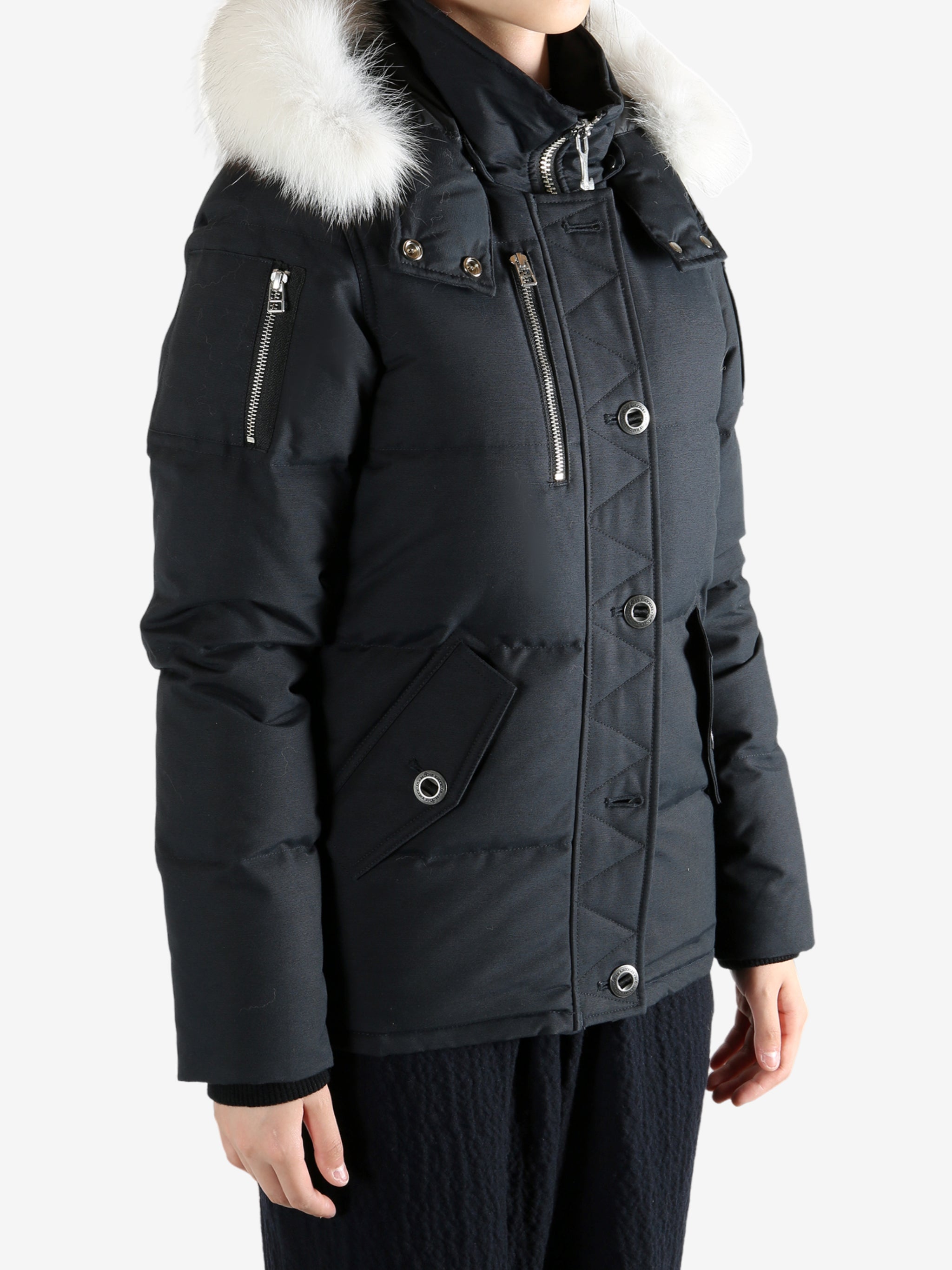 Black jackets worn by a person, showing the jackets fit