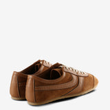 Tan sneakers, back view