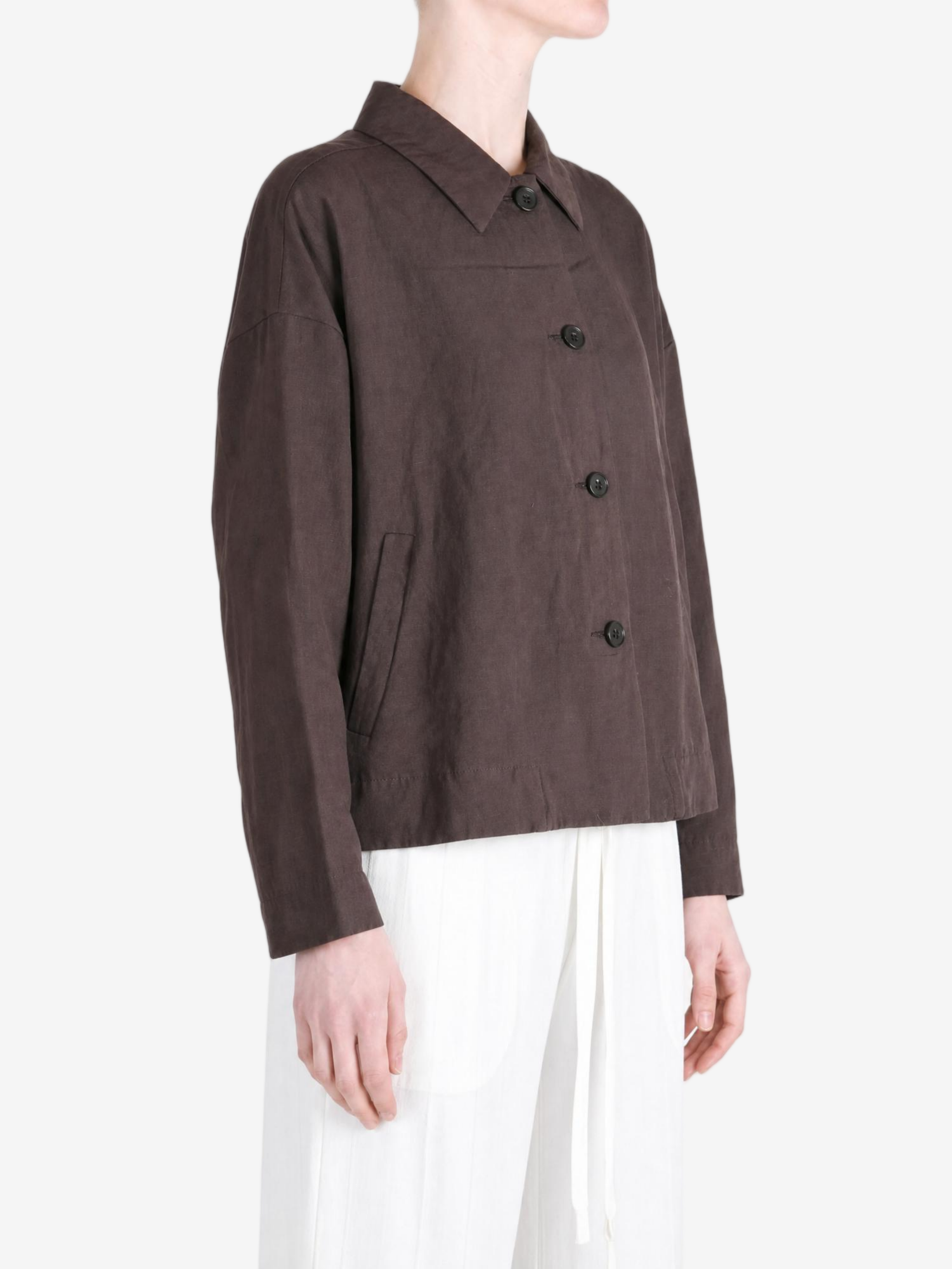 Brown jacket worn by a person, showing the jacket fit