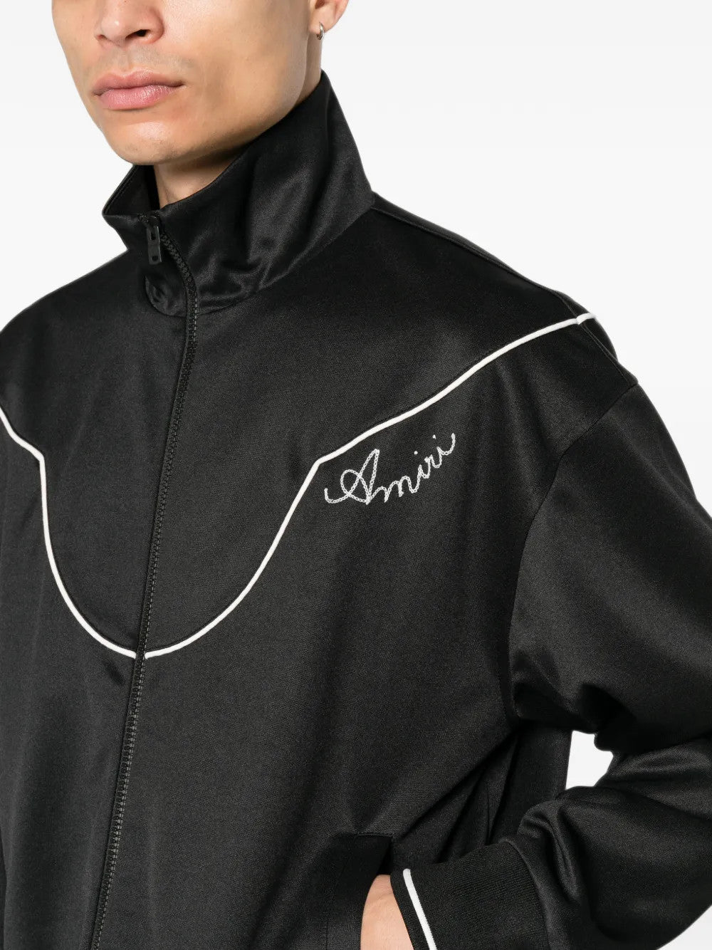 Black jacket worn by a person, showing the jacket fit