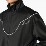 Black jacket worn by a person, showing the jacket fit