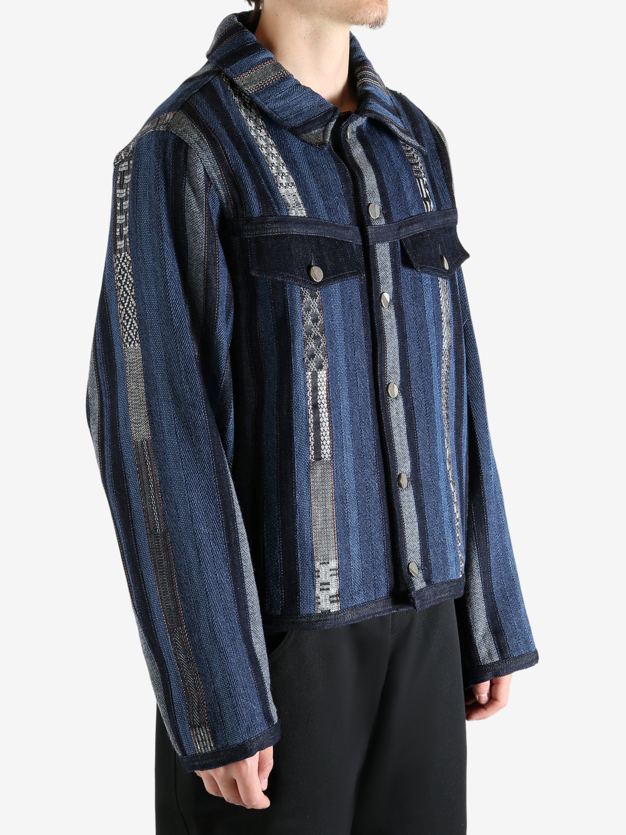 Blue jacket worn by a person, showing the jacket's fit