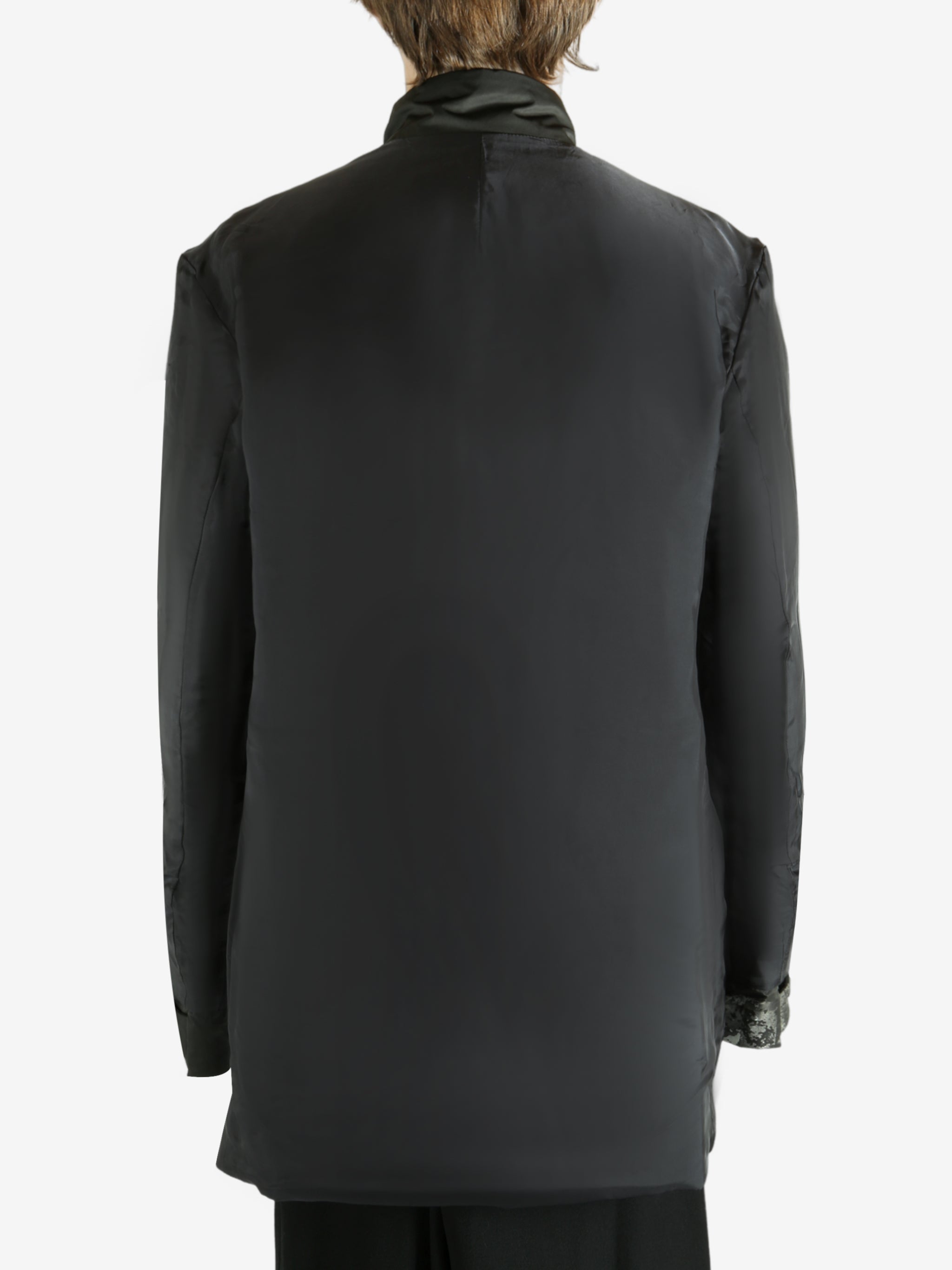 Black jacket worn by a person, showing the jacket's fit