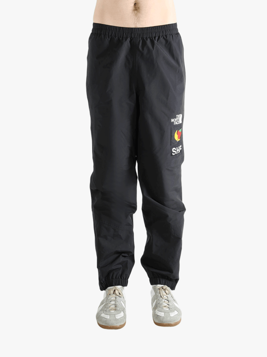 Black pants worn by a person showing the pants fit