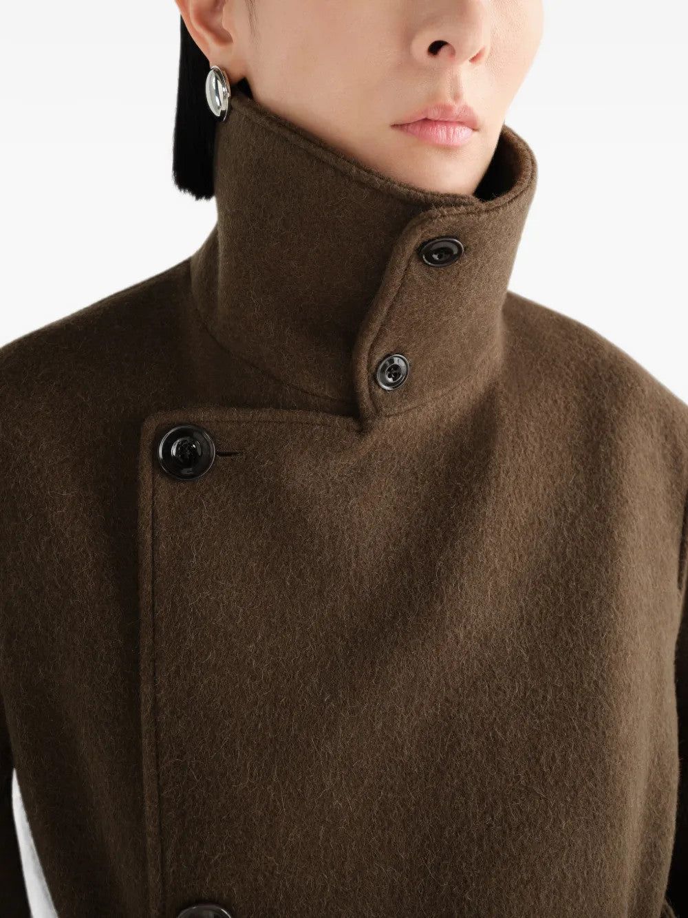 Brown jacket worn by a person, showing the jacket fit