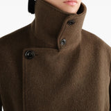 Brown jacket worn by a person, showing the jacket fit