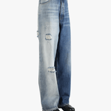 blue jeans worn by a person, showing the jeans  fit
