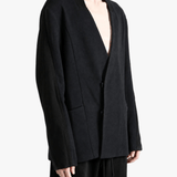 Black jacket worn by a person, showing the jacket fit