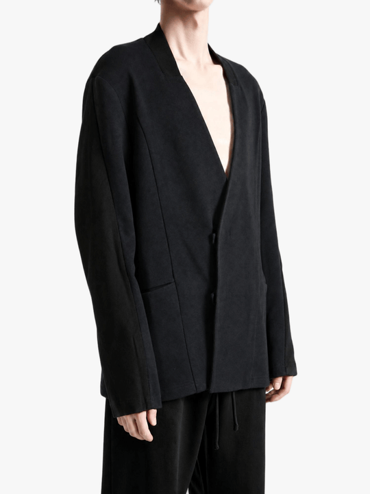 Black jacket worn by a person, showing the jacket fit