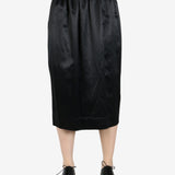 black skirt worn by a person, showing the skirt fit
