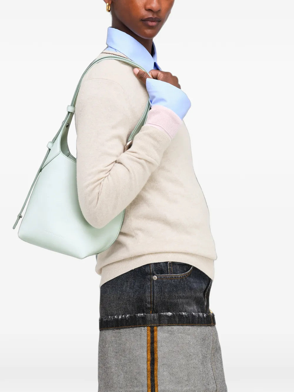 Green bag worn by a person, showing the bag fit